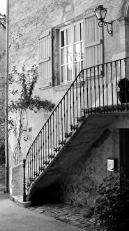 Curving Gallery: Stone staircase with wrought iron rail, France
