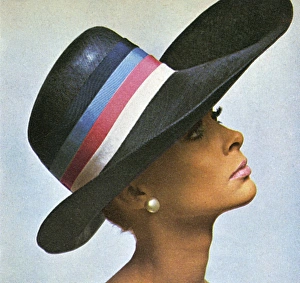 <b class=qtipBold><figcaption>Straw stetson hat by Peter Shepherd</figcaption></b><br>Model wearing a navy straw stetson with blue, pink and white band by Peter Shepherd. Worn with make-up by Max Factor. Date: 1966<br><em>© Illustrated London News Ltd/Mary Evans</em> Straw stetson hat by Peter Shepherd