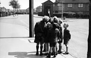 Street telephone fire alarm with group of children