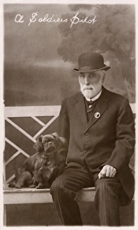 Studio portrait, man with Pekingese dog Studio portrait, man with Pekingese dog