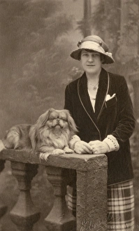Studio portrait, woman with Pekingese dog Studio portrait, woman with Pekingese dog