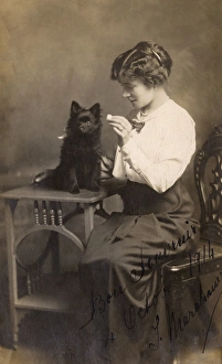 Studio portrait, woman with Pomeranian dog Studio portrait, woman with Pomeranian dog