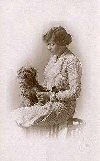 Studio portrait, woman with Yorkshire terrier Studio portrait, woman with Yorkshire terrier
