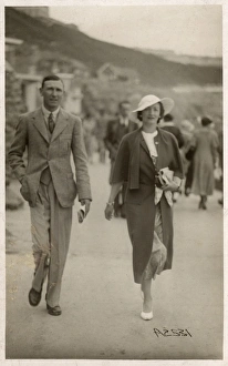 Stylish holiday couple in Scarborough walk along the beach Stylish holiday couple in Scarborough walk along the beach