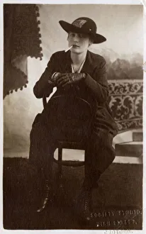 Very Stylish Young Woman stitting backward on a chair Very Stylish Young Woman stitting backward on a chair