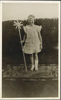 A sweet little girl dressed up in a fairy costume. She' A sweet little girl dressed up in a fairy costume. She'