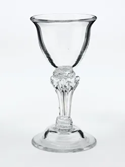 <b class=qtipBold><figcaption>Sweetmeat glass</figcaption></b><br>Sweetmeat glass with a plain bowl and everted rim on an eight-sided pedestal stem with a teared cushion knop, and a domed foot, made in England c.1750. Date: c.1750<br><em>© The Geffrye Museum of the Home / Mary Evans Picture Library</em> Sweetmeat glass