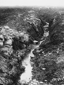 <b class=qtipBold><figcaption>Switch trench</figcaption></b><br>A British soldier in a flooded, muddy switch trench. The purpose of a switch trench was to connect trench systems.<br><em>© Mary Evans/Robert Hunt Collection</em> Switch trench