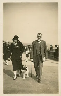 Taking dog for a walk along the seafront at Scarborough Taking dog for a walk along the seafront at Scarborough