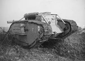 Prints of An armoured tank breaking through a barbed wire barricade on a battlefield during the First World War Battlefield Prints: Armoured Tank Breaking Through Barbed Wire Barricade Print