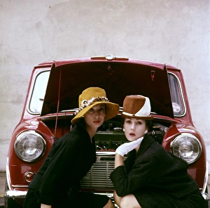 <b class=qtipBold><figcaption>Tatler cover photoshoot</figcaption></b><br>Tatler cover photoshoot focusing on hats and the Motor Show -- two female models posing in front of a red Mini car. A variant shot from this particular photoshoot was used for the cover of The Tatler issue for 21 October 1959 (see image 11064837). 1959<br><em>© The Colin Sherborne Collection/Mary Evans Picture Library</em> Tatler cover photoshoot