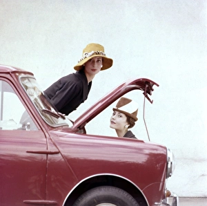 <b class=qtipBold><figcaption>Tatler cover photoshoot</figcaption></b><br>Tatler cover photoshoot focusing on hats and the Motor Show -- two female models posing with a red Mini car. A variant shot from this particular photoshoot was used for the cover of The Tatler issue for 21 October 1959 (see image 11064837). 1959<br><em>© The Colin Sherborne Collection/Mary Evans Picture Library</em> Tatler cover photoshoot