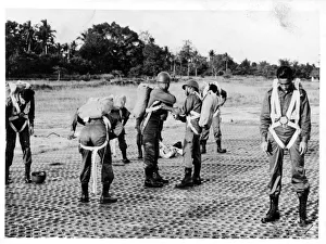 Thai paratroopers fitting parachutes Thai paratroopers fitting parachutes