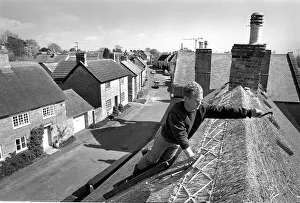 Thatcher working on Somerset cottage -2 Thatcher working on Somerset cottage -2