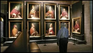 Images Dated 13th June 2007: Tourist looking at portraits of Avignon popes, France
