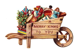 Toys in a wheelbarrow on a cutout Christmas card Toys in a wheelbarrow on a cutout Christmas card