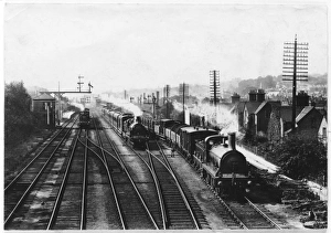 <b class=qtipBold><figcaption>Trains at Redhill</figcaption></b><br>A goods train waits on one track to let the passenger train go through, while a third train approaches through the station at Redhill, Surrey.<br><em>© Mary Evans Picture Library</em> Trains at Redhill