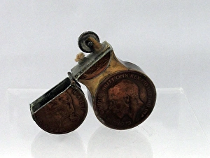 Trench Art lighter in the shape of the number eight Trench Art lighter in the shape of the number eight