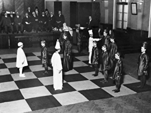 <b class=qtipBold><figcaption>Using Boys as Chessmen</figcaption></b><br>Thirty-two pupils from Ramsgate schools act as living chessmen in two matches that form part of Kent Chess Association's Easter Congress.<br><em>© Mary Evans Picture Library</em> Using Boys as Chessmen