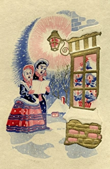 Victorian carol singers on a Christmas card Victorian carol singers on a Christmas card