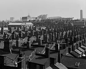 View across rooftops towards City of London View across rooftops towards City of London