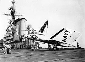 Vought F7U-3 Cutlass 128454 with folded wings on USS Midwa Vought F7U-3 Cutlass 128454 with folded wings on USS Midwa