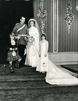 <b class=qtipBold><figcaption>Wedding of Princess Anne</figcaption></b><br>Wedding of Princess Anne, the Princess Royal to Captain Mark Phillips at Westminster Abbey on 14 November 1973. The couple are posed back at Buckingham Palace with their bridesmaid, Lady Sarah Armstrong-Jones and pageboy, Prince Edward, now Duke of Wessex. Date: 1973<br><em>© Illustrated London News Ltd/Mar</em> Wedding of Princess Anne