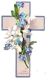 White and blue flowers on a cross-shaped Christmas card White and blue flowers on a cross-shaped Christmas card