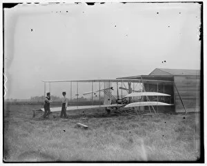 Brothers Gallery: Wilbur and Orville Wright with their second powered machine