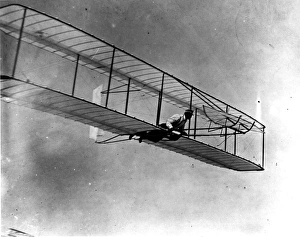 Wilbur Wright in the 1902 glider in flight Wilbur Wright in the 1902 glider in flight
