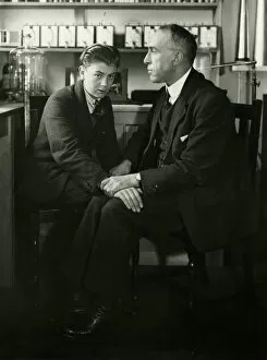 Price Collection: Willi Schneider when young seated with Harry Price