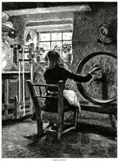 Winding weft at a spinning wheel in Northern Ireland Winding weft at a spinning wheel in Northern Ireland