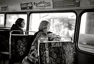 Upholstery Gallery: Woman with two children on a bus, Manchester