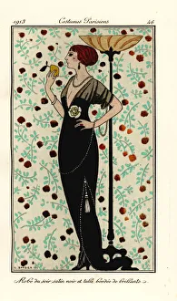 Woman in evening gown of black satin and tulle Woman in evening gown of black satin and tulle