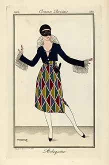 Woman in harlequin costume and mask for a fancy dress ball Woman in harlequin costume and mask for a fancy dress ball