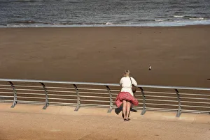 A woman on the north promenade at Blackpool A woman on the north promenade at Blackpool