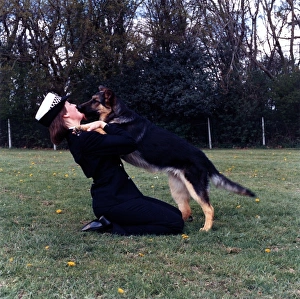 Woman police dog handler with dog, London Woman police dog handler with dog, London