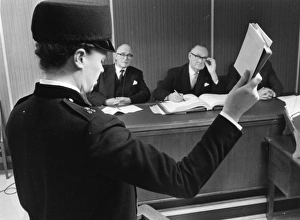 Witness Gallery: Woman police officer taking oath in court, London