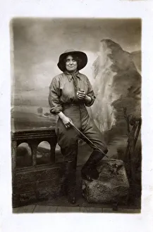 A Woman posing as a frontiersperson in a studio A Woman posing as a frontiersperson in a studio