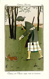 Campagne Gallery: Woman with shotgun in hunting outfit of green