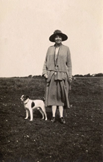 Woman out walking with a dog, Eastbourne, Sussex Woman out walking with a dog, Eastbourne, Sussex