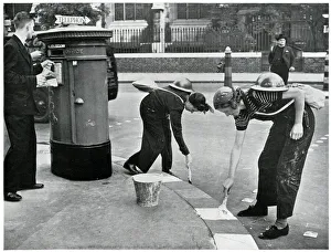 Women painting kerbside for blackouts, September 1939 Women painting kerbside for blackouts, September 1939
