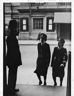 Two women police officers entering Bow Street police station Two women police officers entering Bow Street police station
