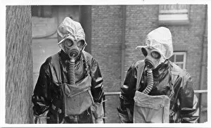 Two women police officers in gas masks, London, WW2