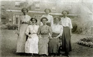 Flowerbed Gallery: Five women pose for a group photograph in the garden