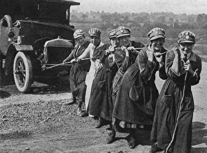 Womens Legion pulling a broken down ambulance, WWI Womens Legion pulling a broken down ambulance, WWI