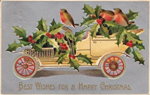 Yellow car with robins and holly on a Christmas postcard Yellow car with robins and holly on a Christmas postcard