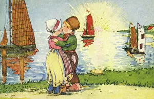 Netherlands Collection: Young Dutch boy and girl share a kiss at sunset