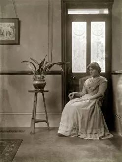 Young Edwardian woman and plant