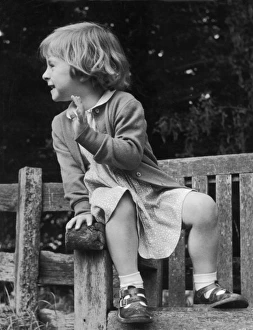 <b class=qtipBold><figcaption>Young Girl on Bench 1950</figcaption></b><br>A young girl sits on the arm of a bench.<br><em>© Mary Evans Picture Library 2015 - https://copyrighthub.org/s0/hub1/creation/maryevans/MaryEvansPictureID/10078124</em> Young Girl on Bench 1950